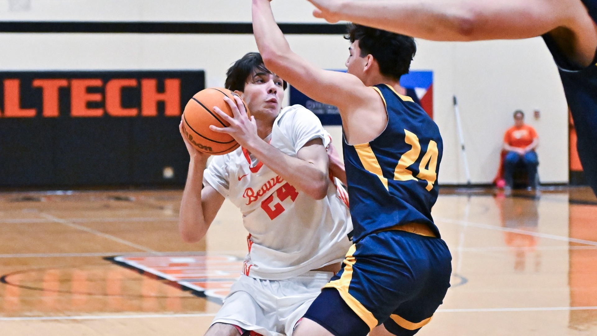 Dorian Glogovac closely guarded by two UC Santa Cruz players