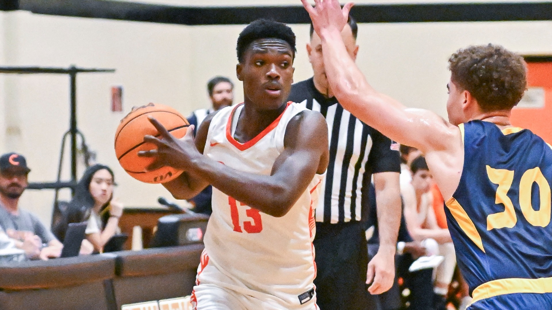 Josh Balami looks to make a pass while guarded by a UC Santa Cruz defender