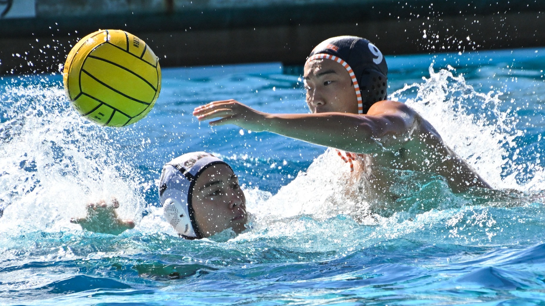 Kaleb Dy passes the ball by an Occidental player