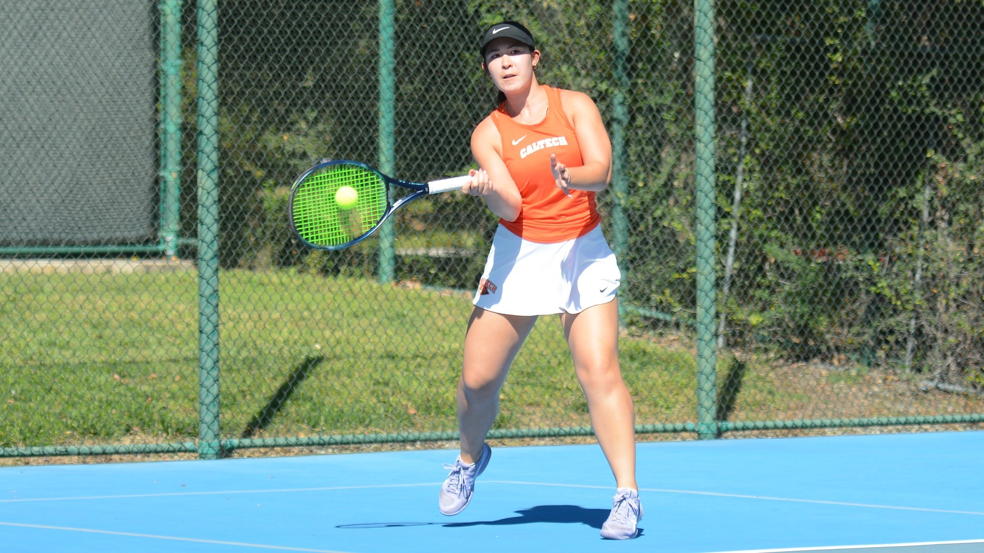 Katelyn Waugh returns a ball with a forehand shot
