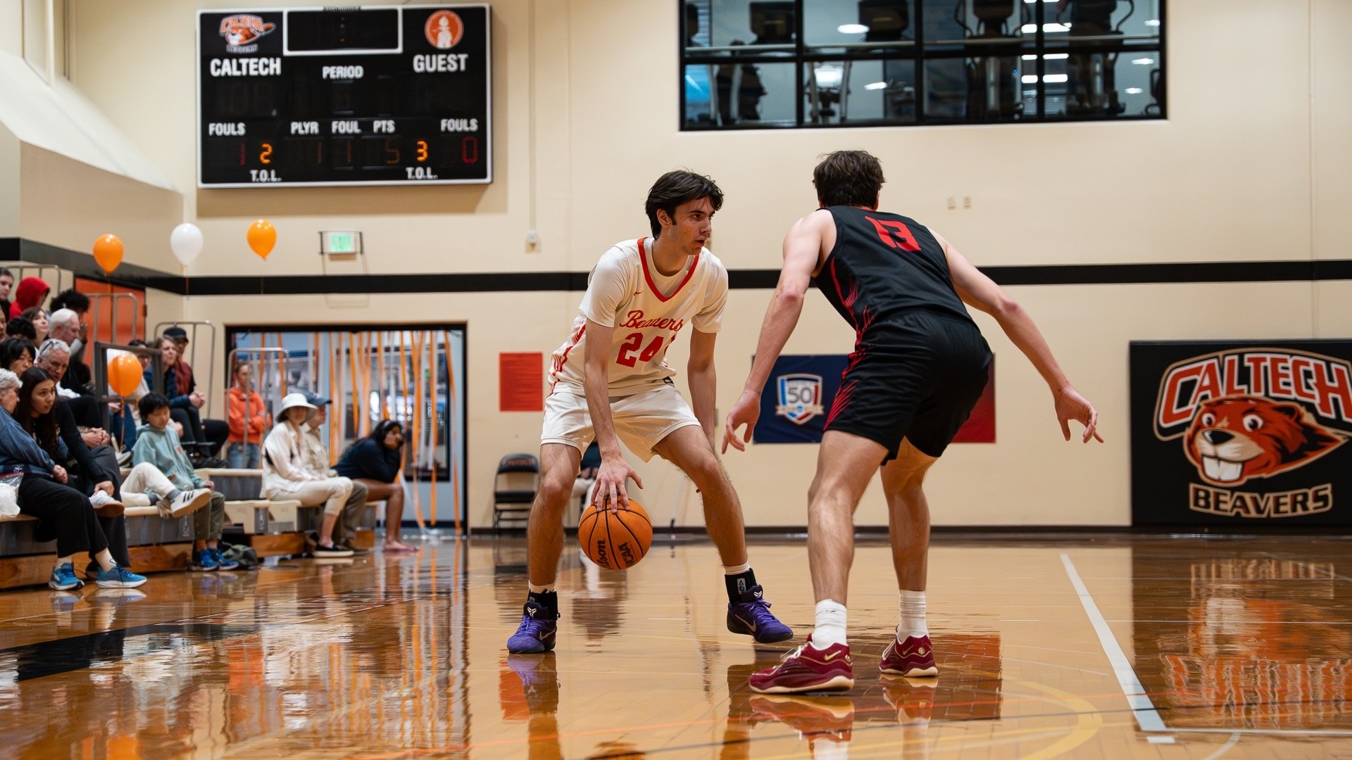 Dorian Glogovac dribbles the ball, guarded by a Chapman defender