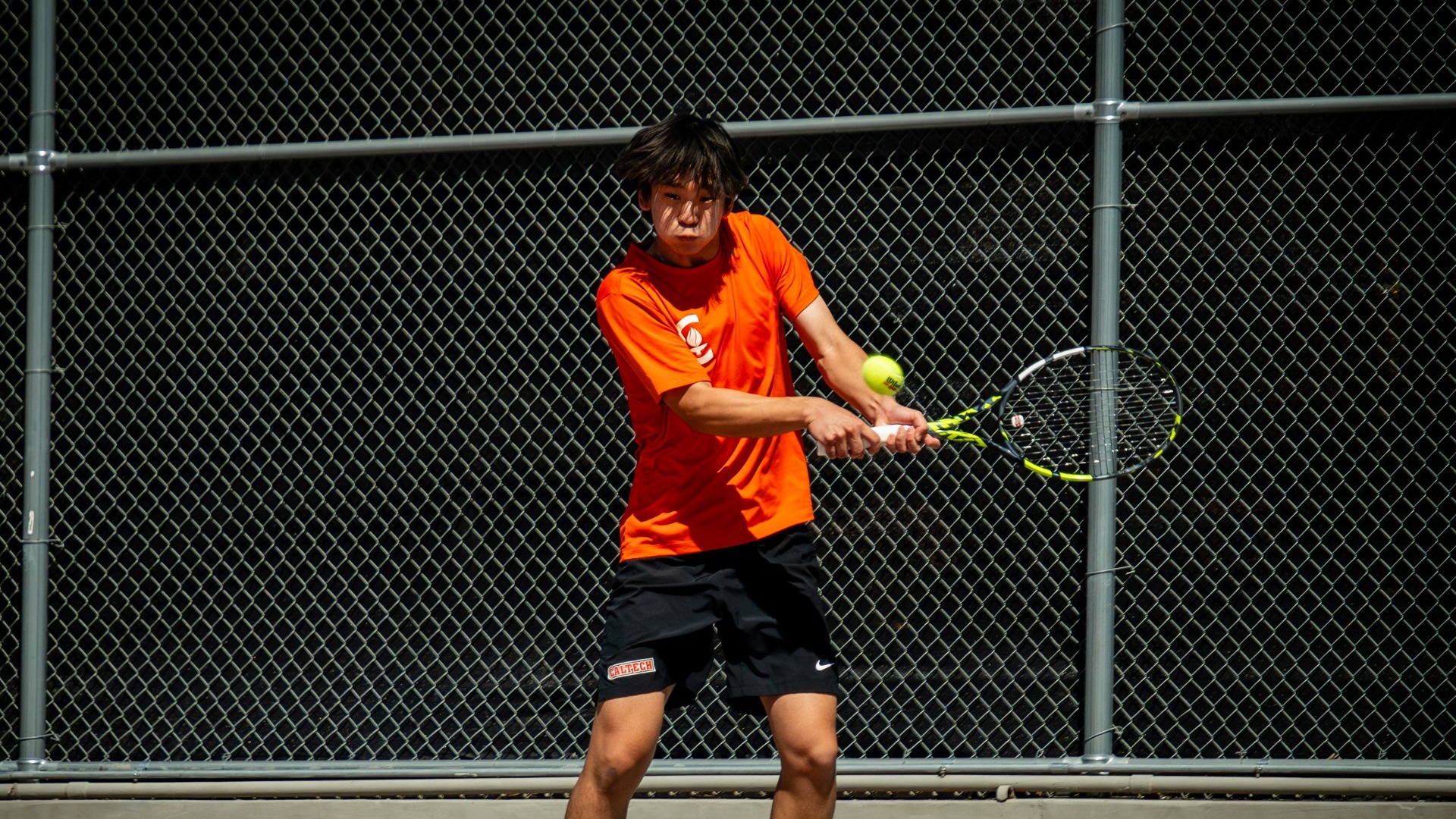 Michael Gao hits a backhand shot