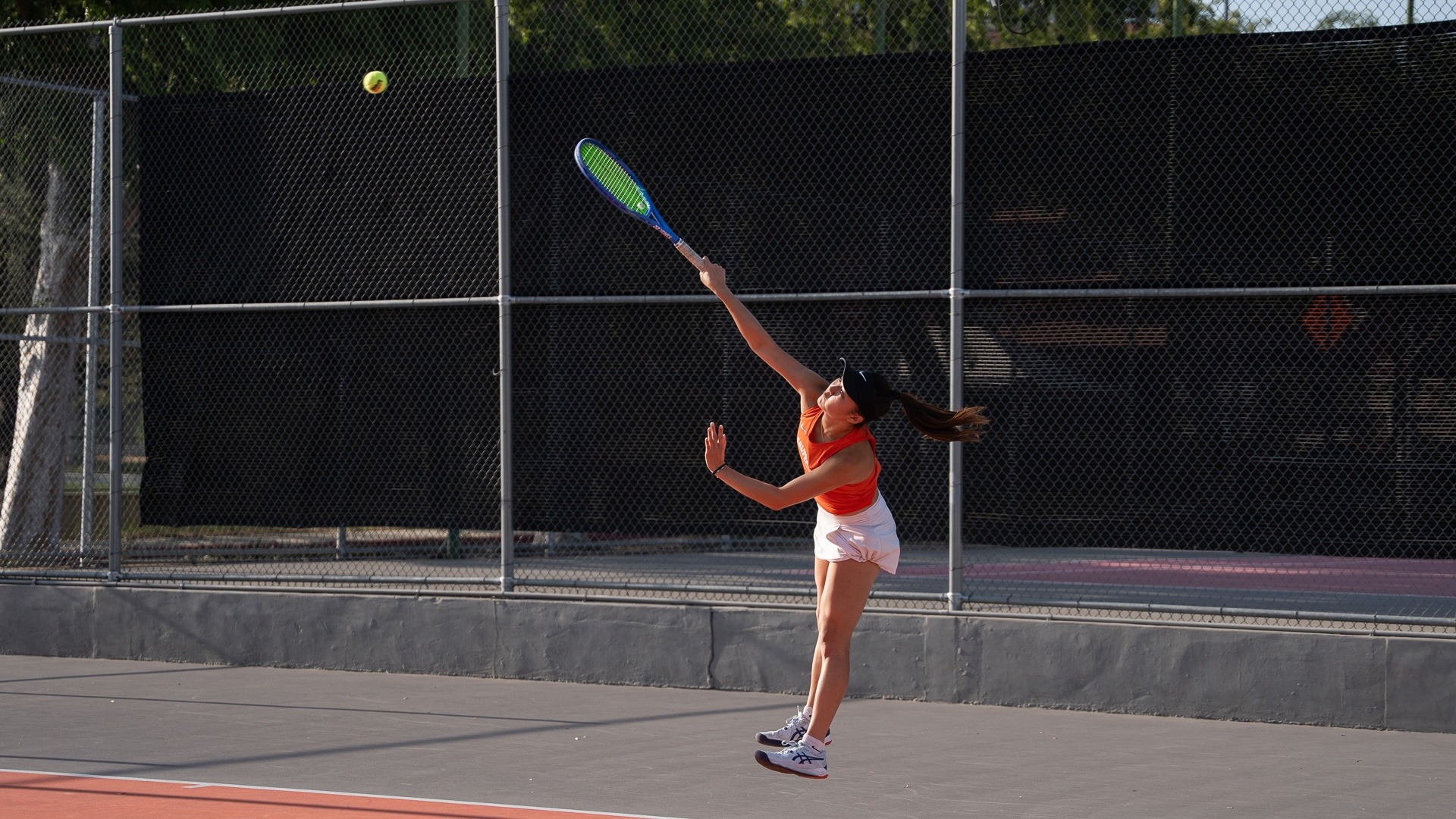 Carissa Gerung serves the ball