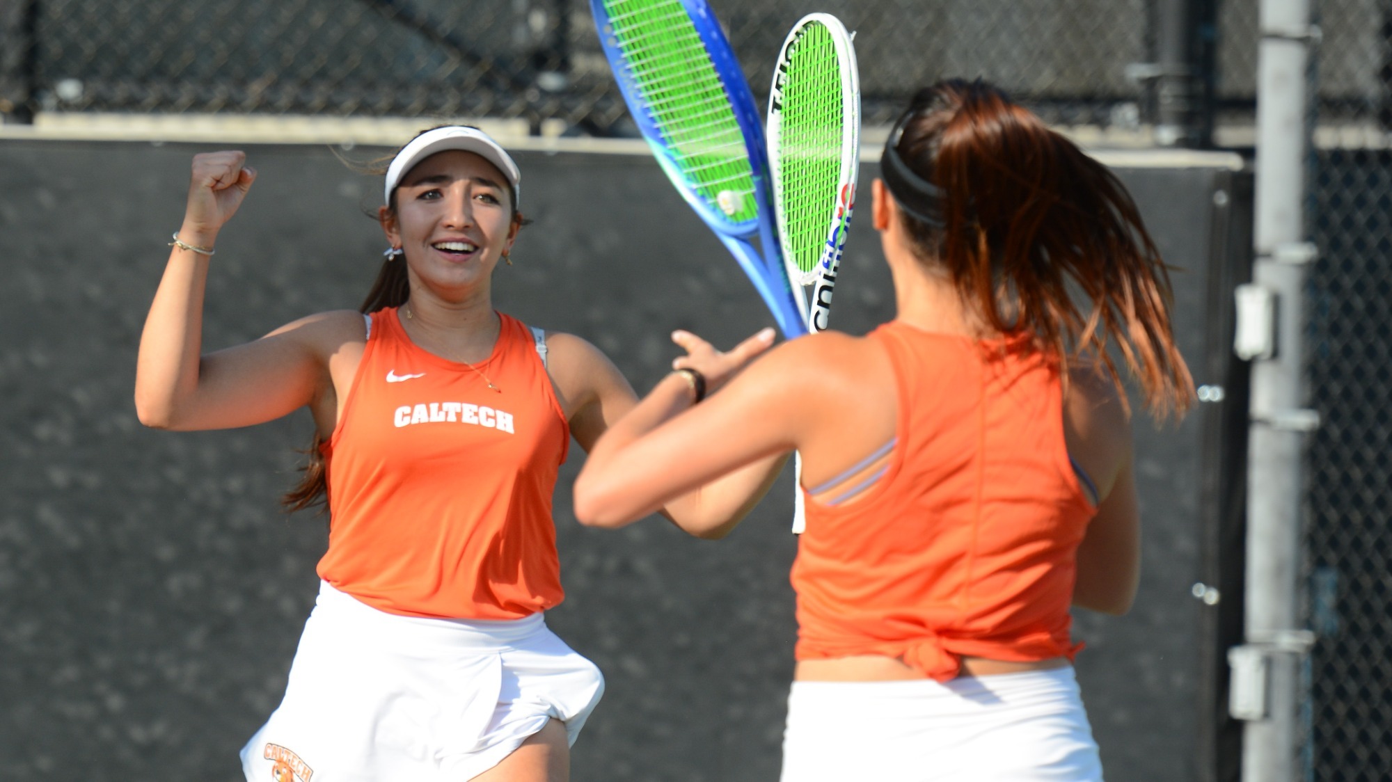 Polaris Hayes celebrates winning a match with Carissa Gerung