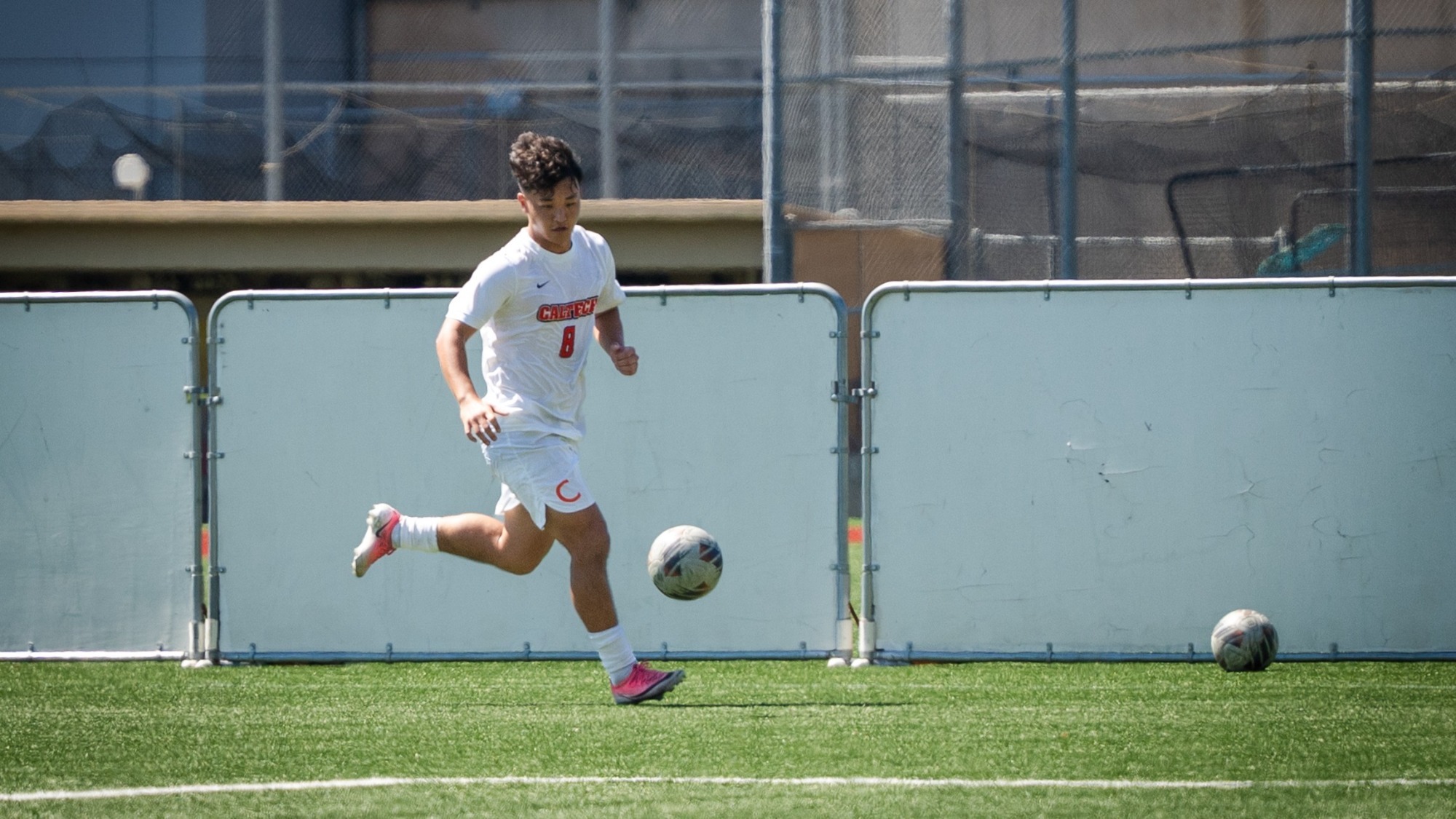 Dean Yao collects the ball on attack against Pomona-Pitzer