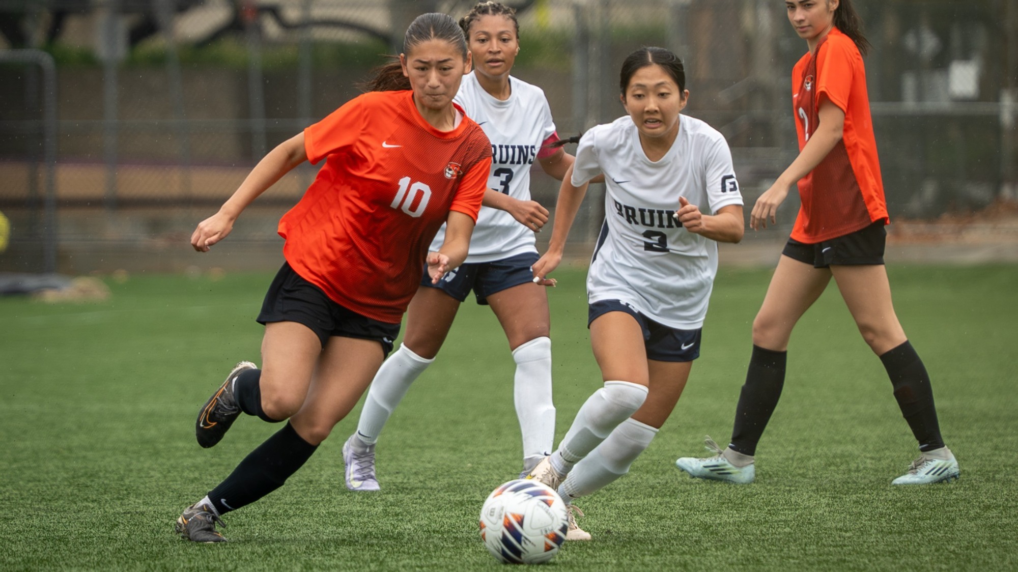 Ellie Yamada Drives with the ball against George Fox 