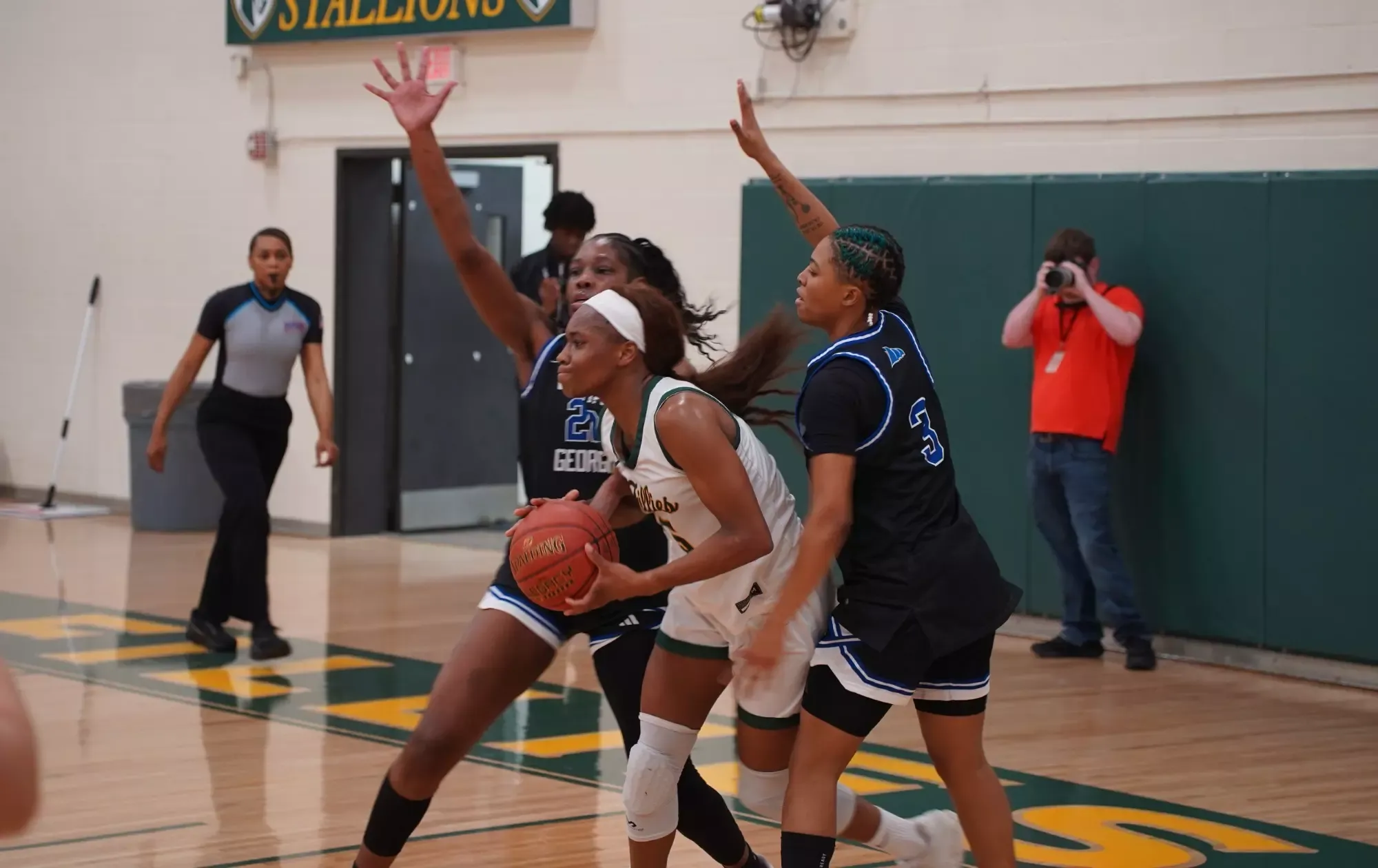 Shakiria Chaney is double-teamed in the paint by College of Coastal Georgia