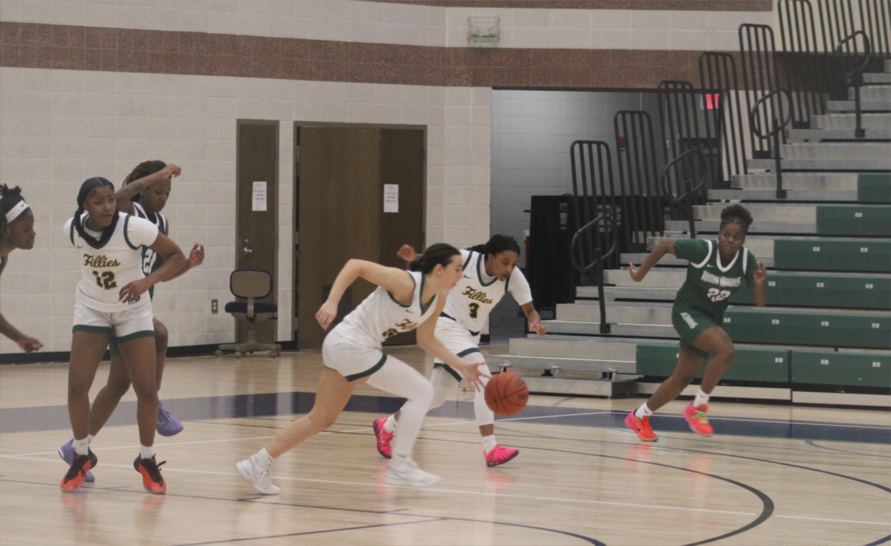 Reese Riddle and Zamiyah Hosley lead a fast break