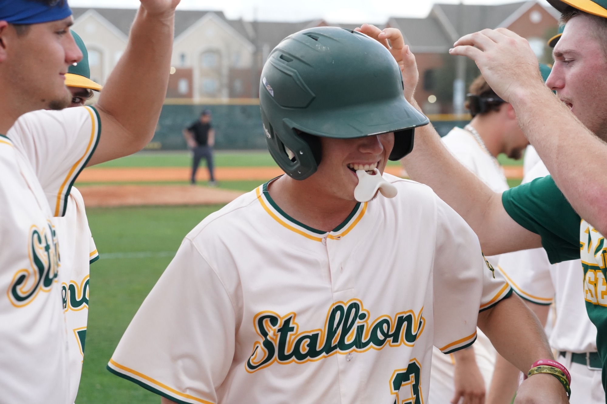Zack Bowman is saluted by teammates during starting lineup introductions