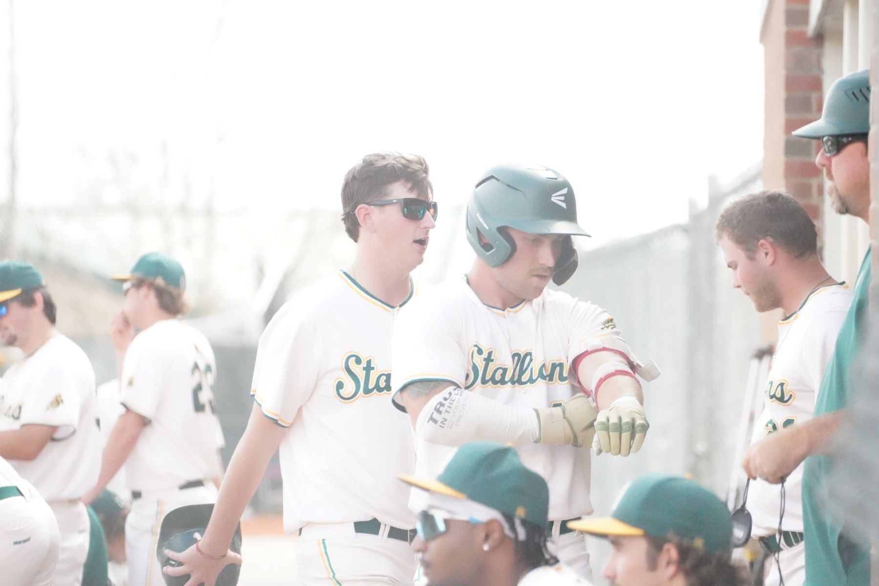 ABAC baseball players gear up in the dugout