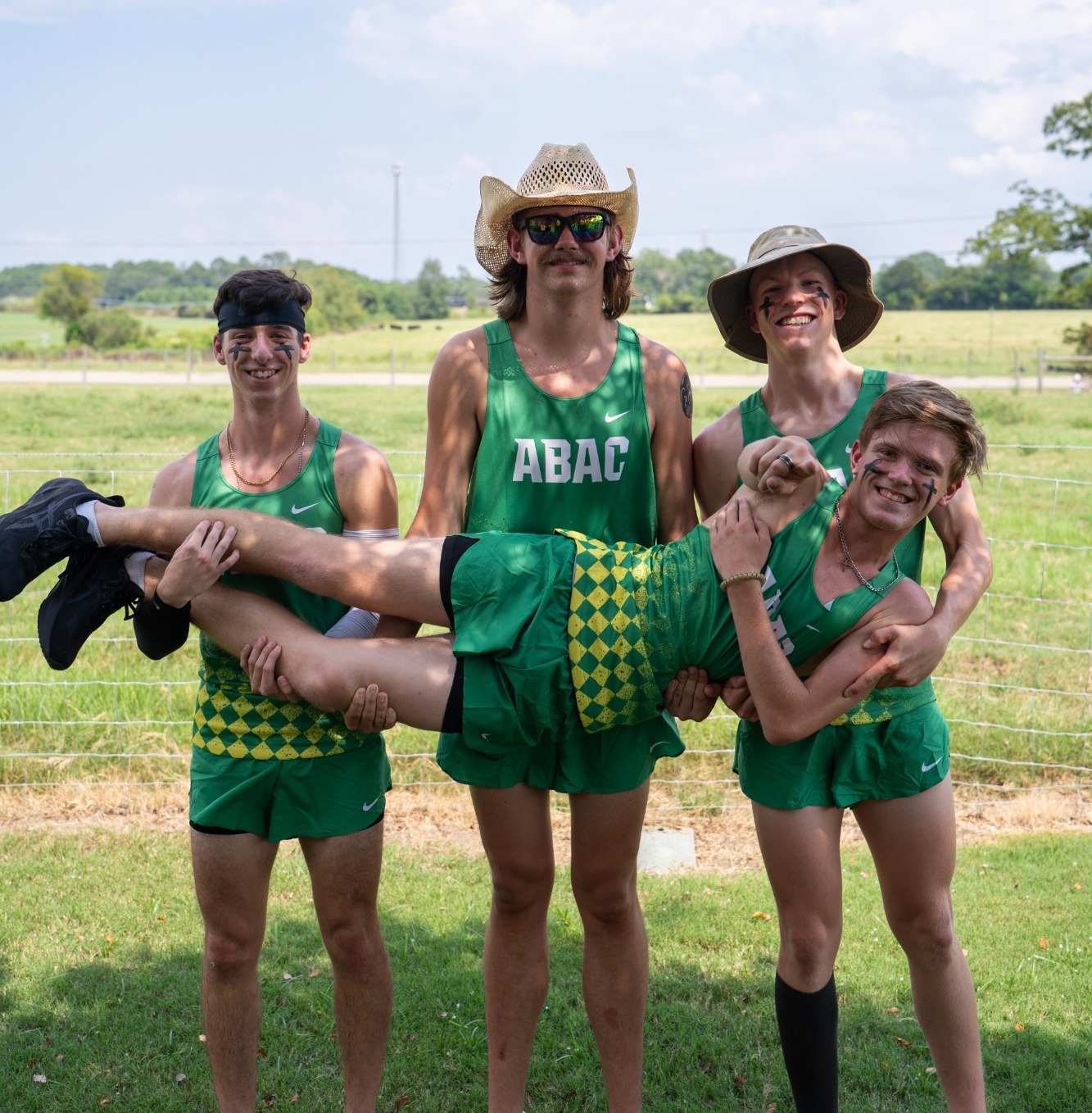 Cross country runners pose in a fun shot at Media Day