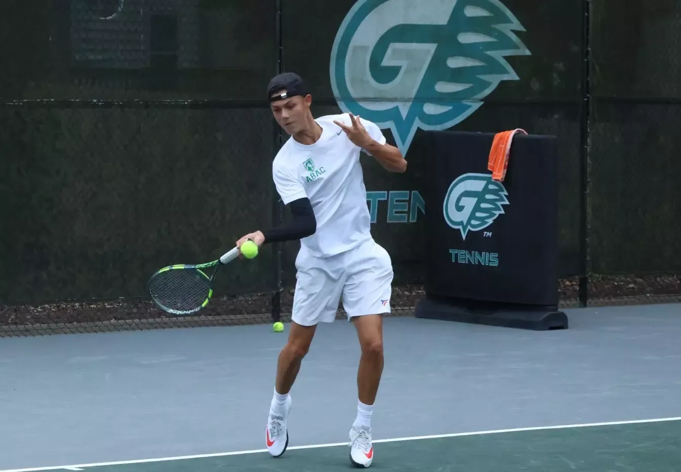 Maxime Vachette returns a forehand at the ITA South Regional
