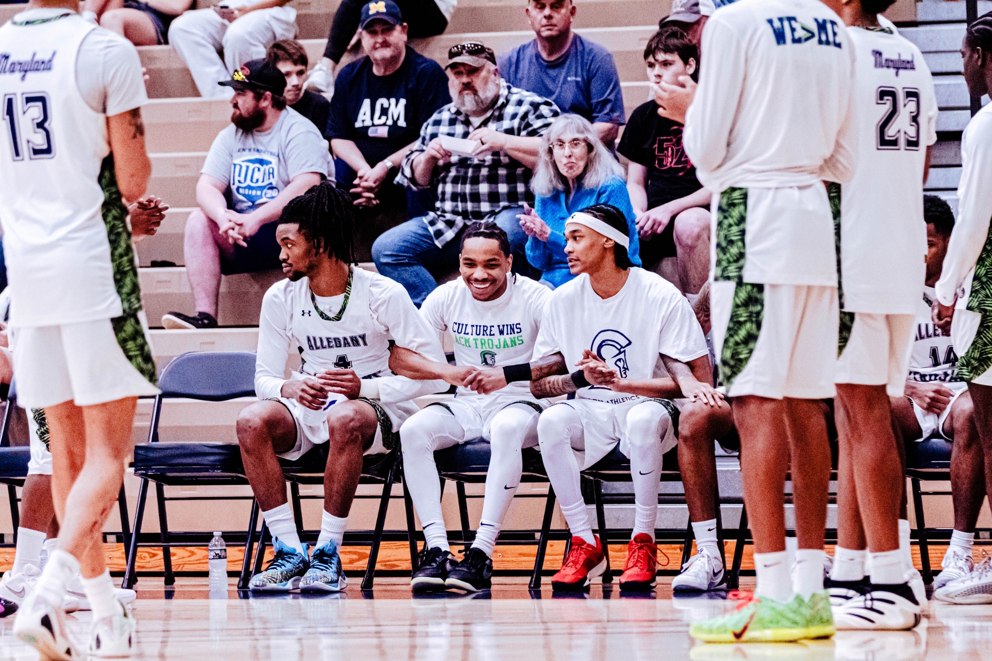 ACM men’s basketball players competing against Harcum College on February 28, 2026, at Bob Kirk Arena, with players driving to the basket and defending in front of the home crowd.”