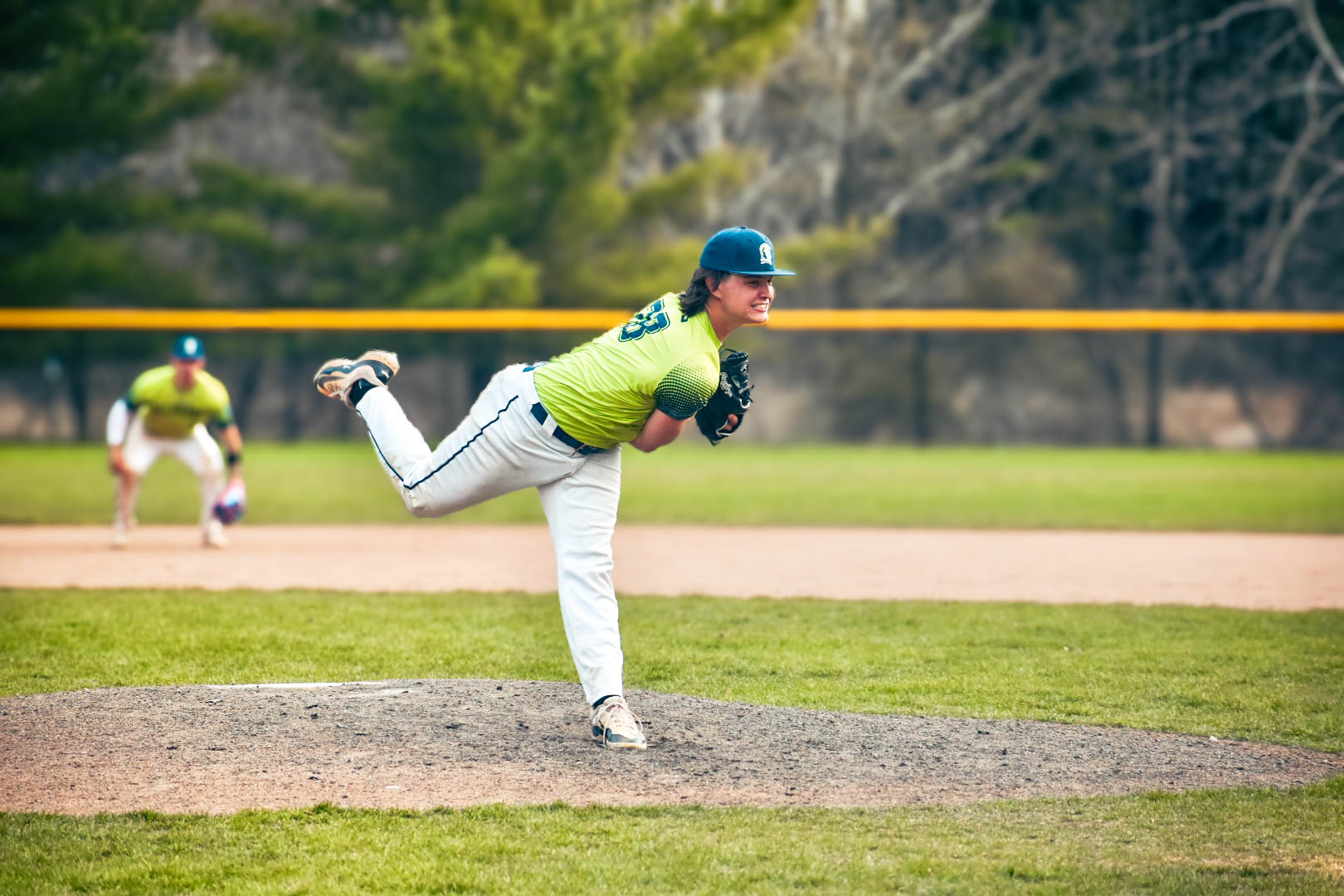 ACM pitcher throwing the ball into the catchers glove.