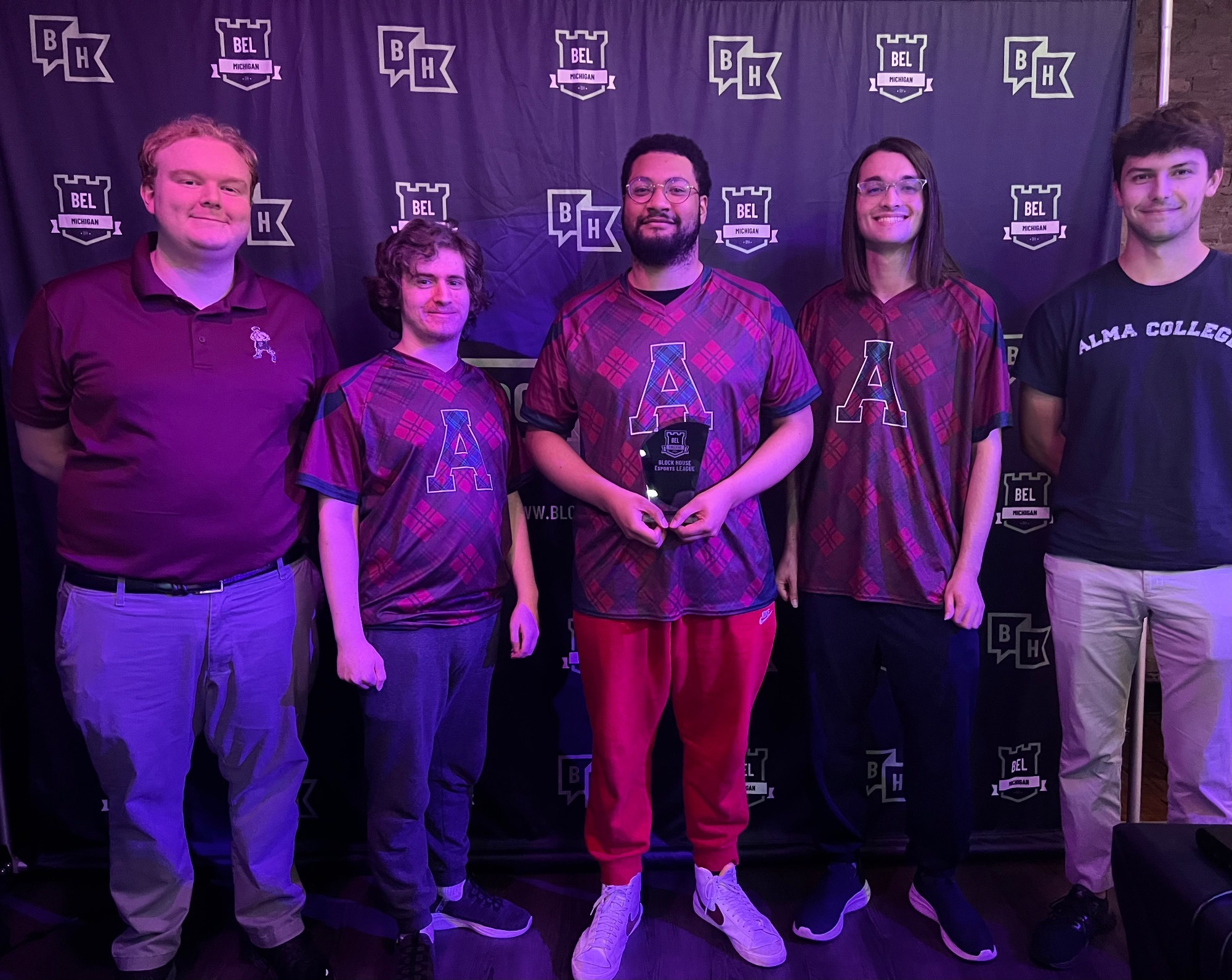 eSports posing with trophies