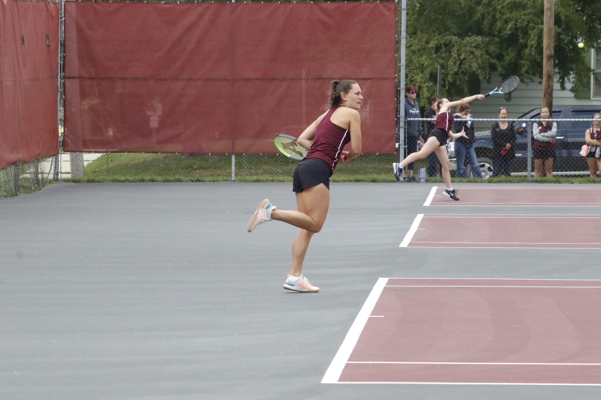 H. Hall returns a serve