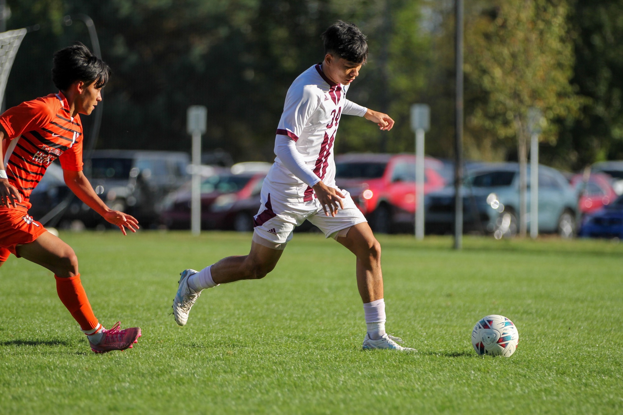 N Hoang dribbles around a defender