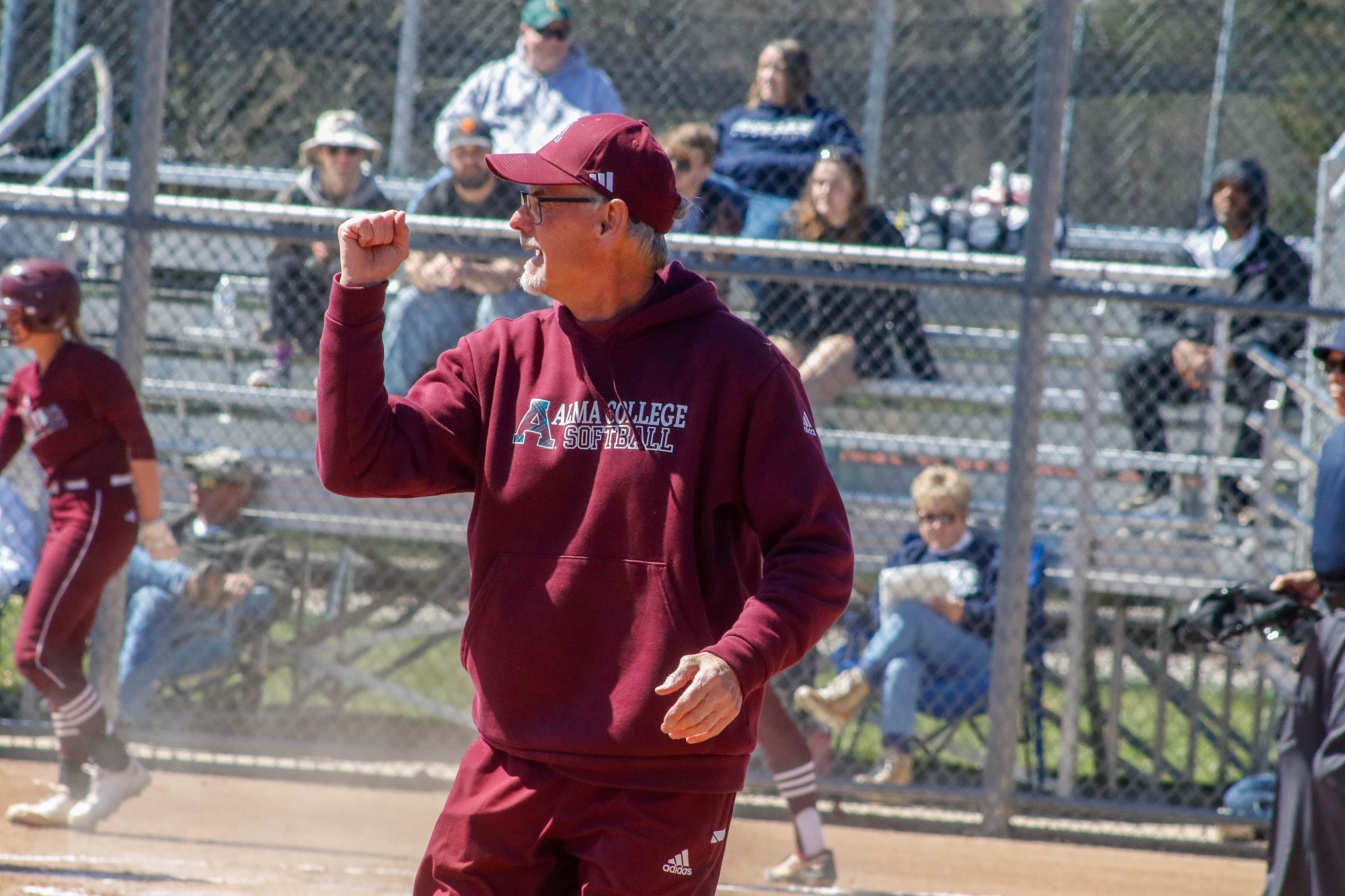 D Griffin coaches at third base