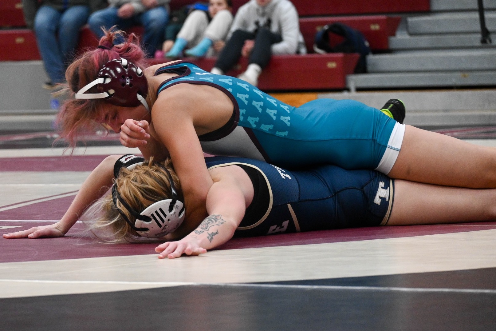 Mia Sharp works on pinning an opponent