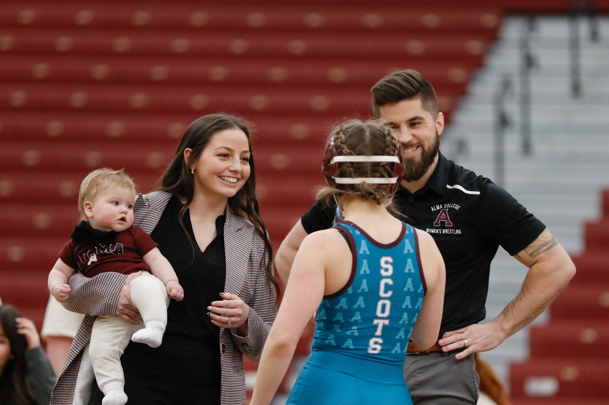 K Pizzo coaches an athlete between periods