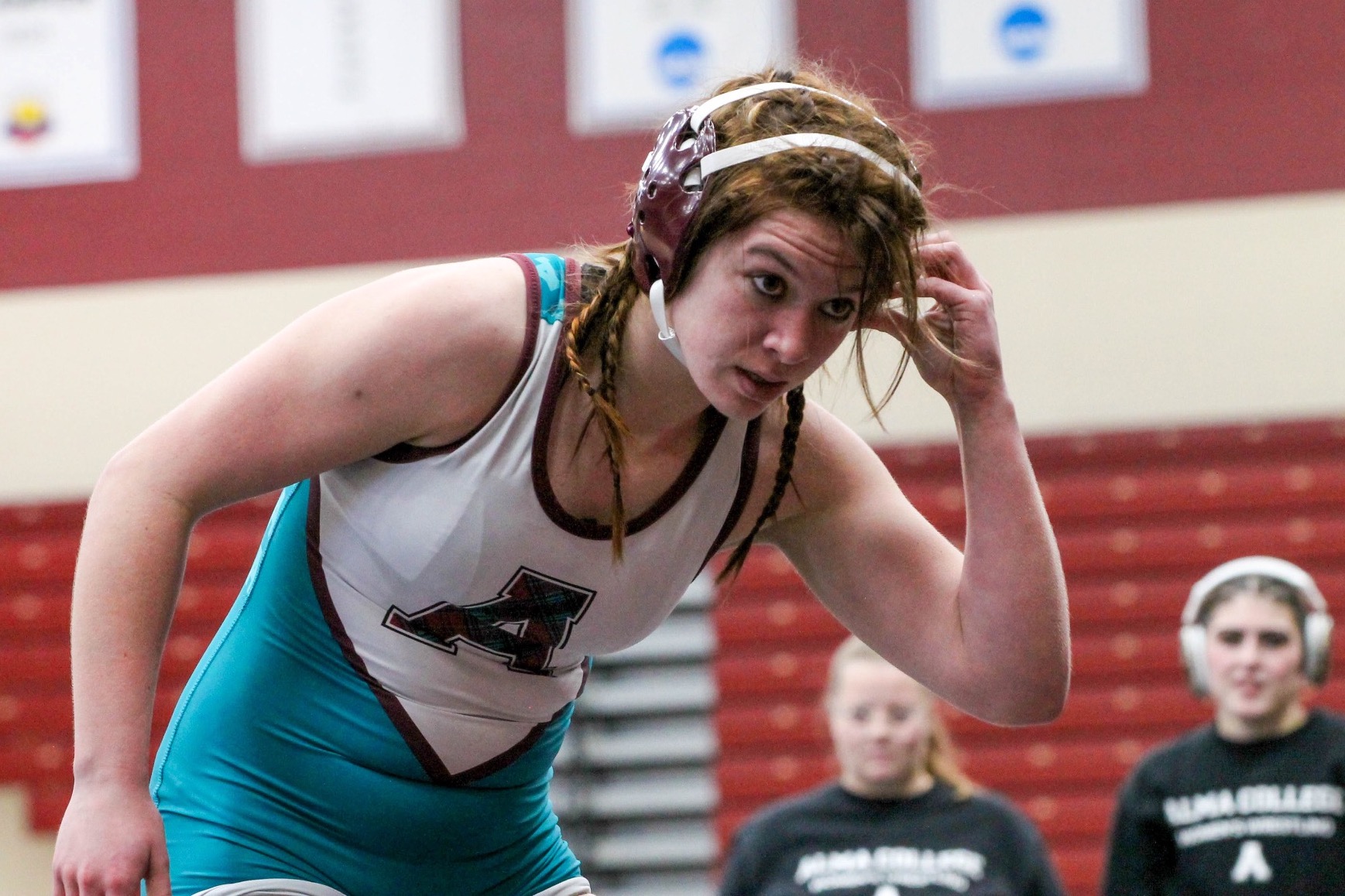 C Mitchell adjusts her headgear during a break