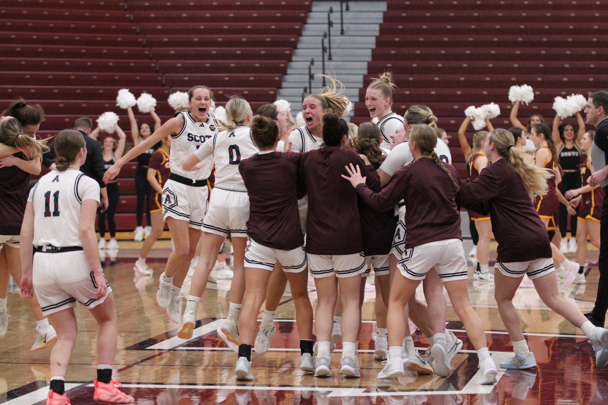 WBB celebrates a win over Calvin