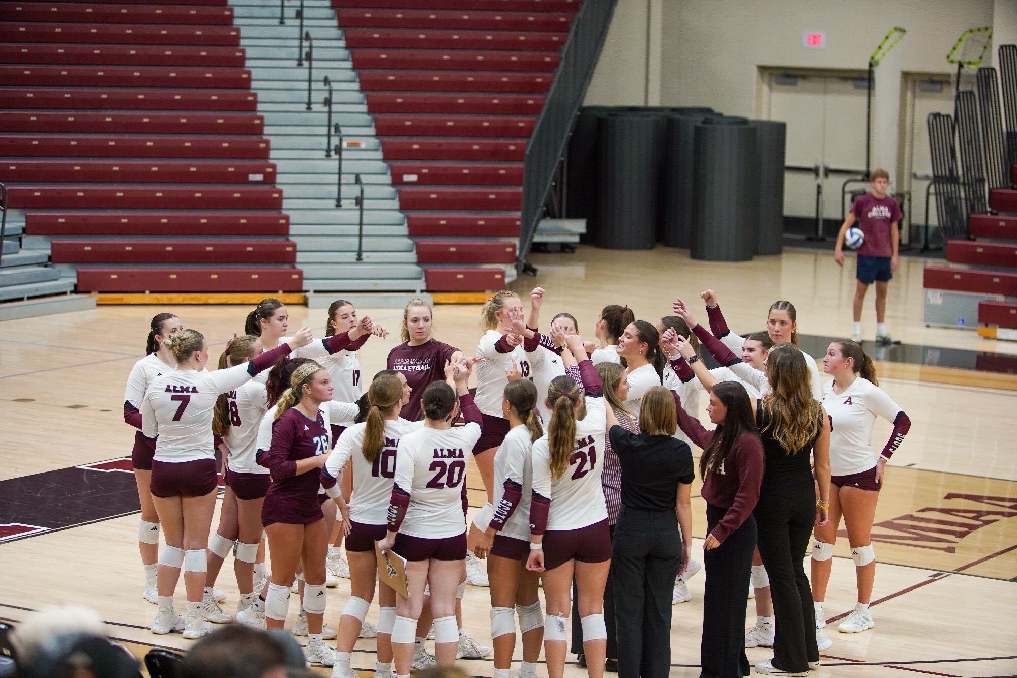 Alma Volleyball huddles during time out