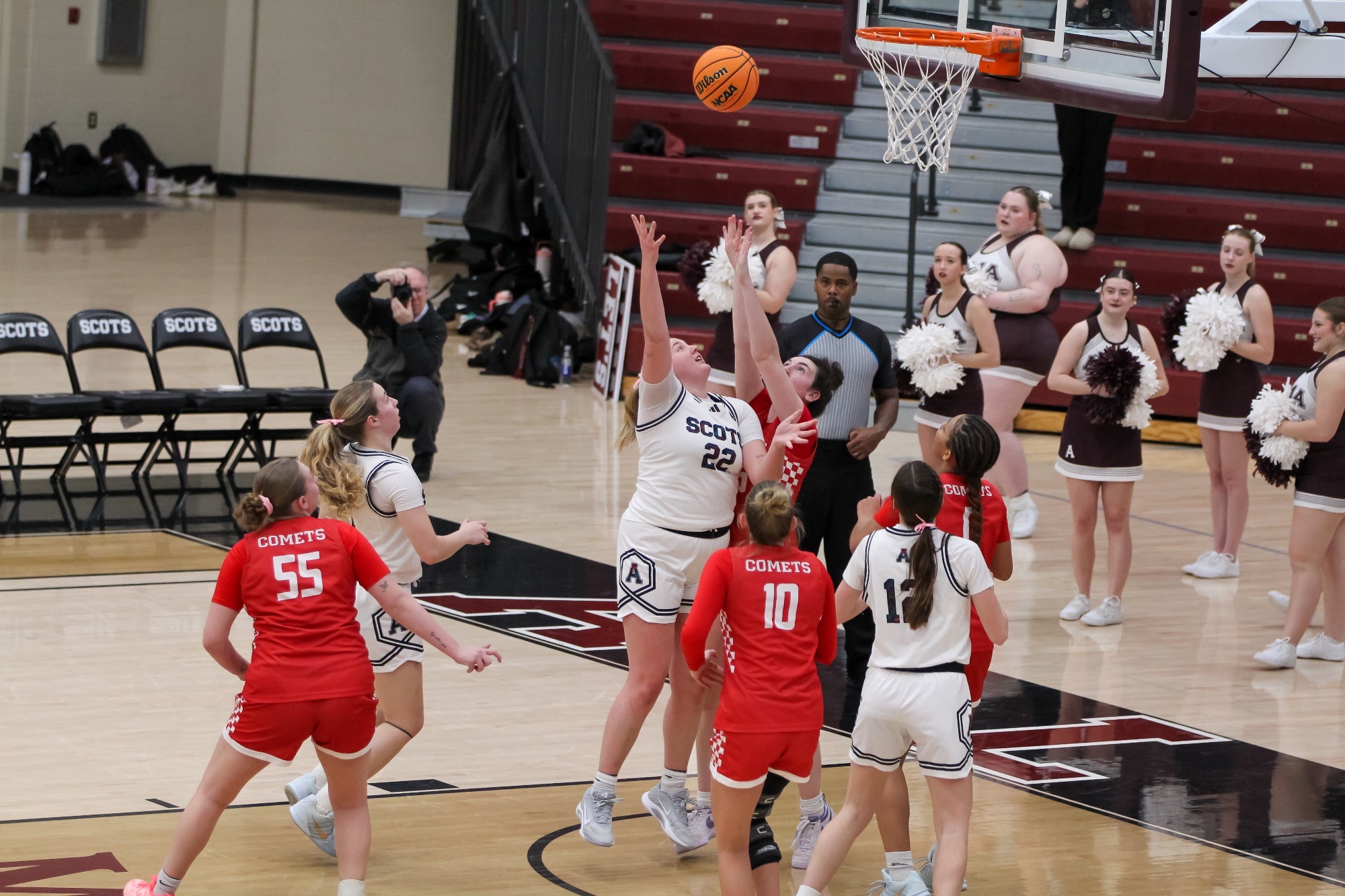 M Weber attempts a shot against Olivet