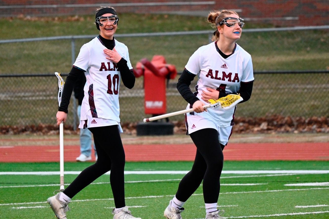 O Lazenby and M Pobocik celebrate a goal