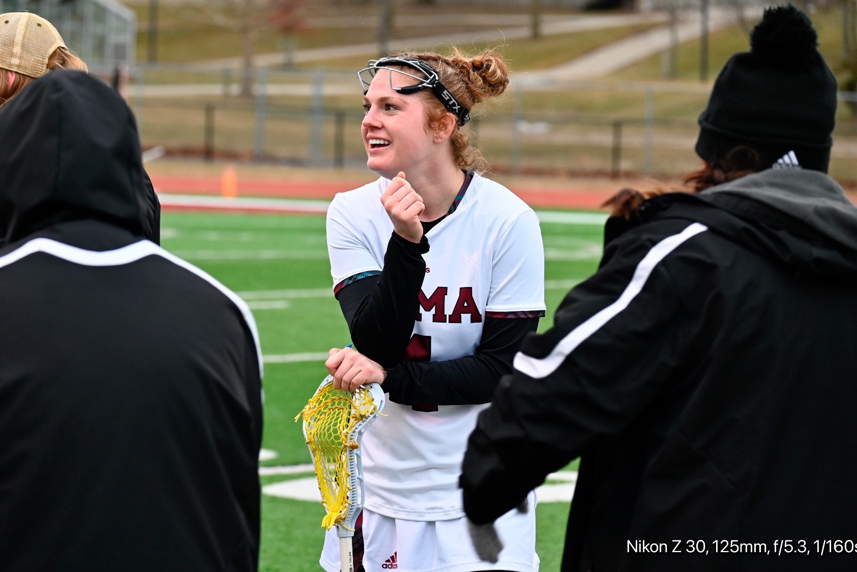 M Pobocik in a team huddle