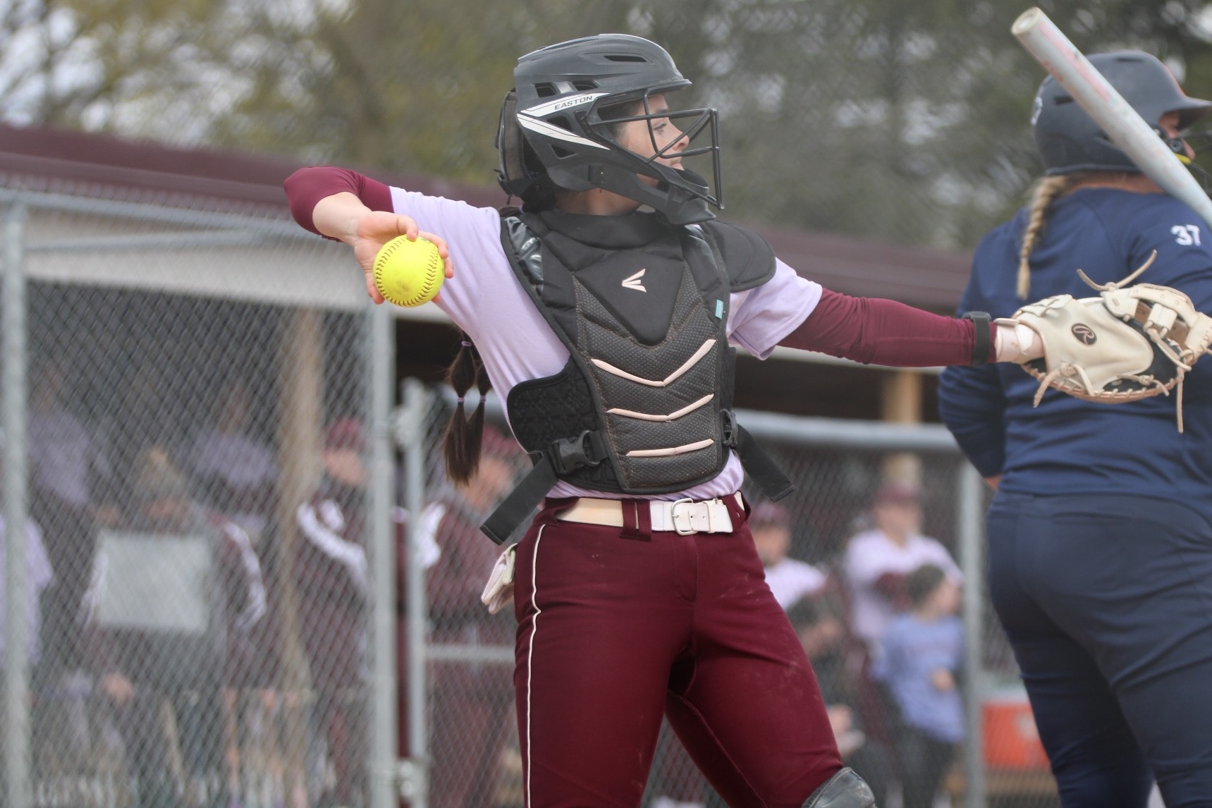 K Holzinger throws a ball back to the pitcher