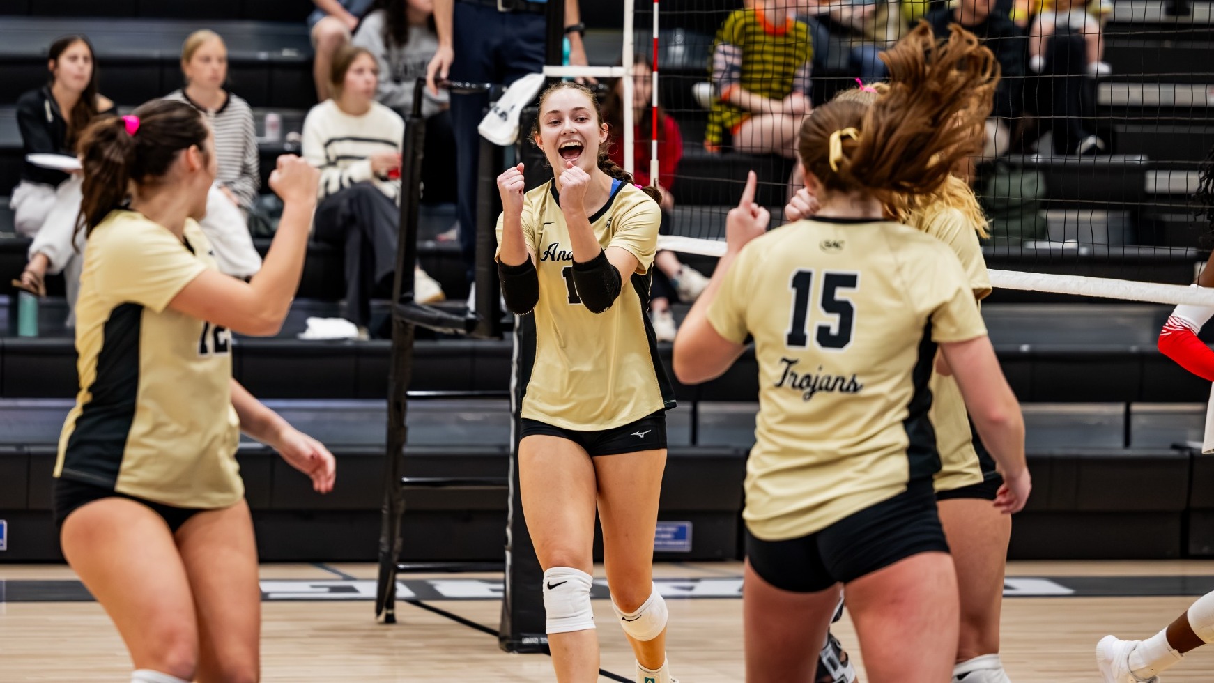 Jacey Olsen and team celebrate versus UVA Wise 