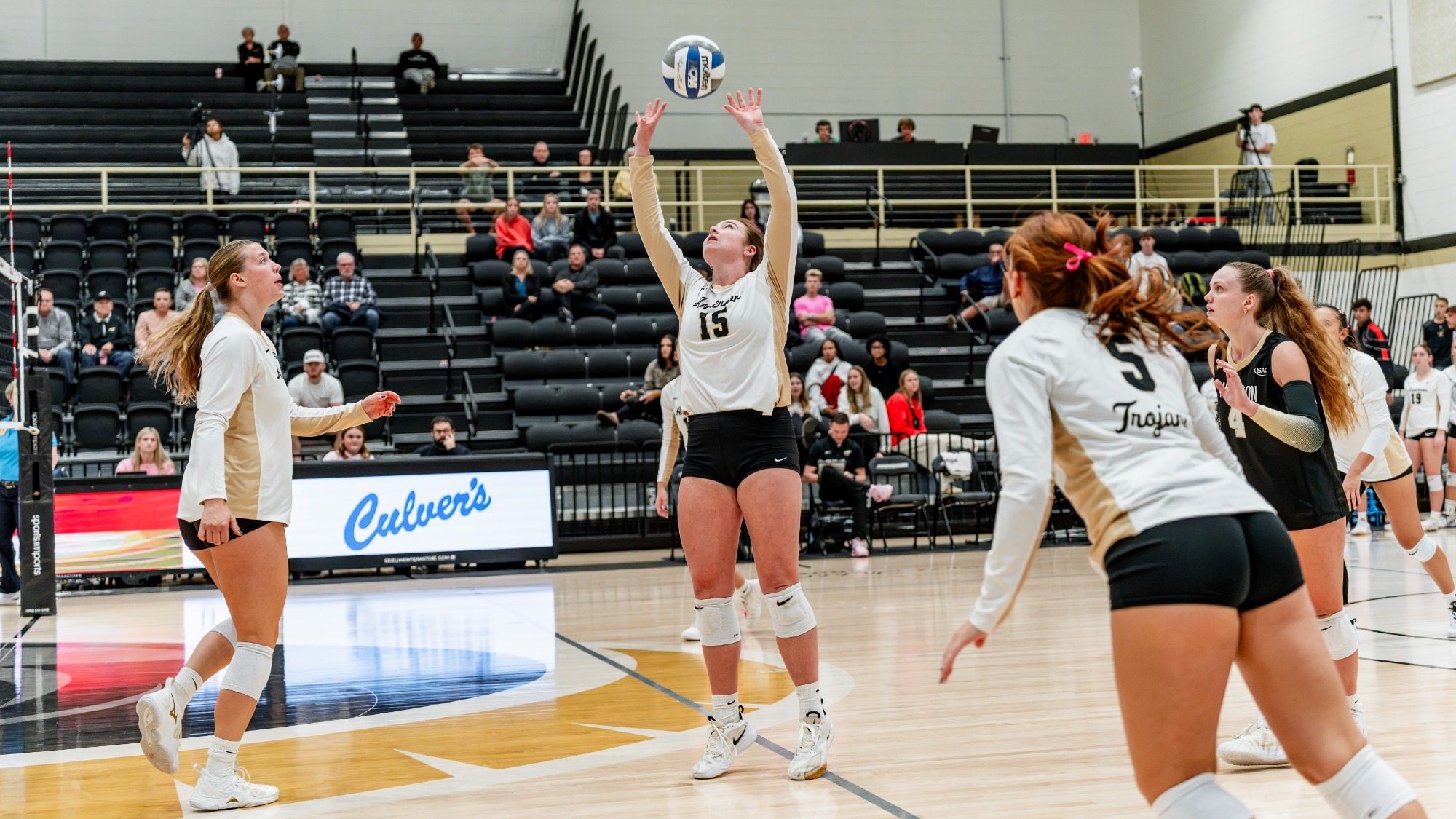 Ellie Nieporte sets the ball to a teammate vs Newberry