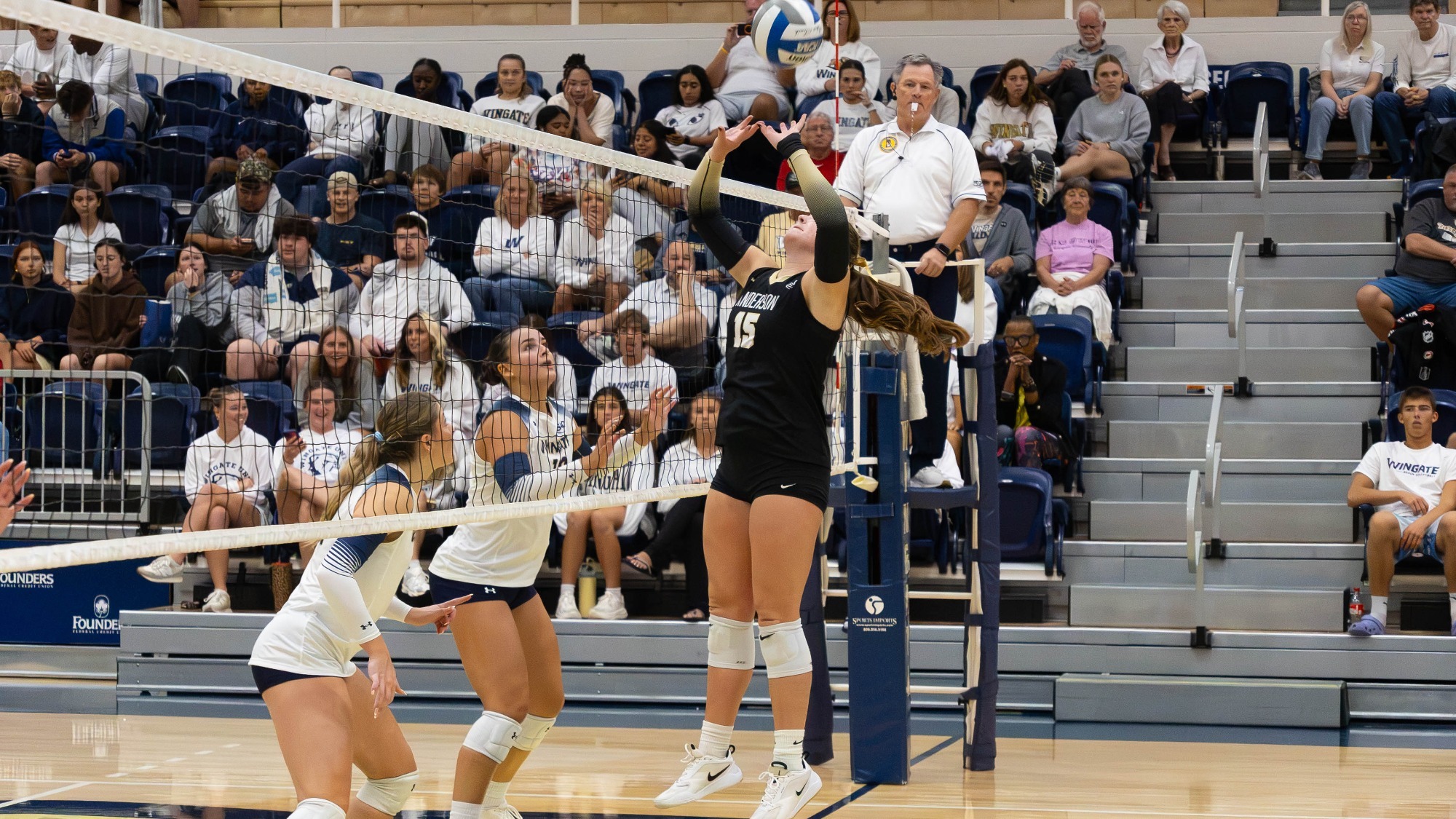 Ellie Nieporte sets the ball versus Wingate 