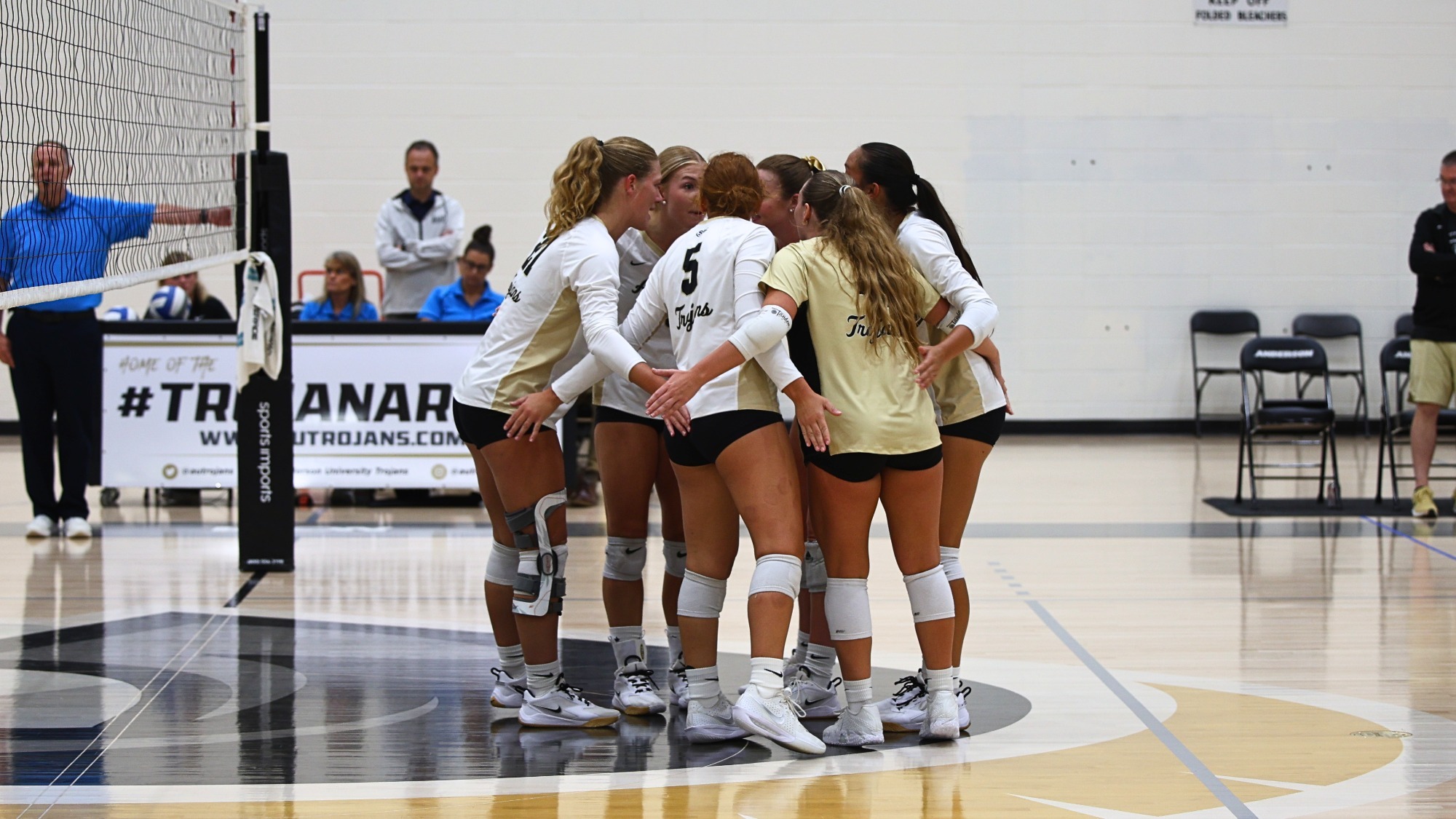 Volleyball team huddles 