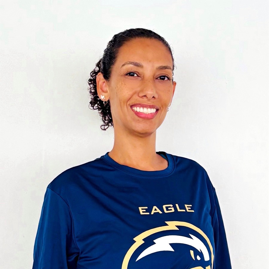 Thais Franca wearing BUF shirt and smiling - Women's Volleyball Head Coach