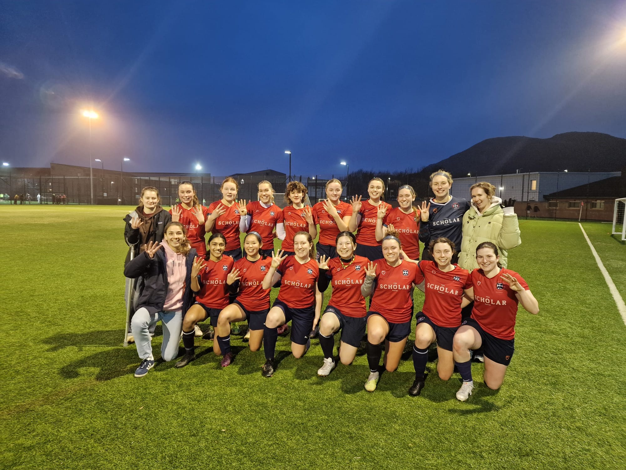 Two rows of women's soccer players