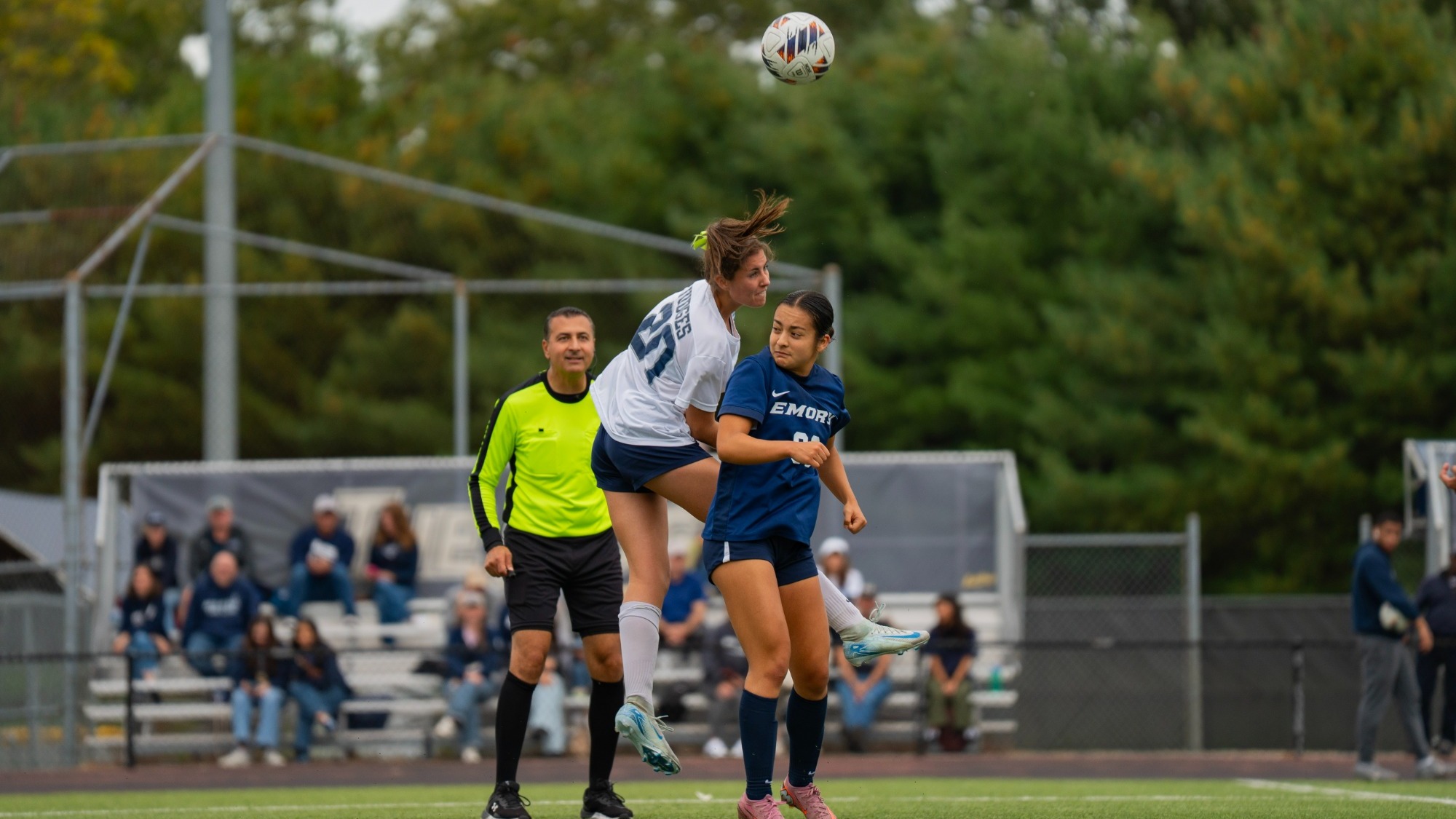 Katie Collins goes high for a header against Emory