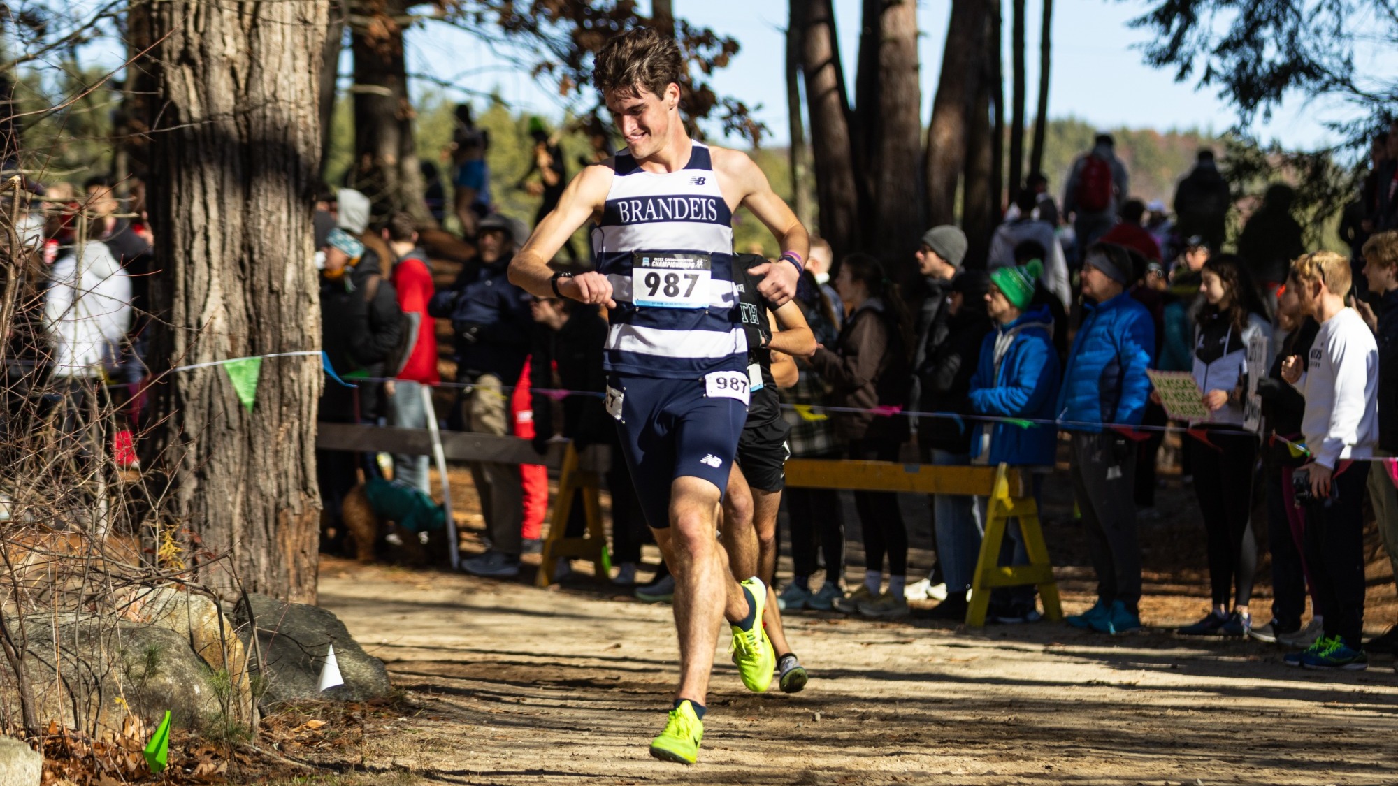 Hugh Licklider checks his time on his watch during a cross country race