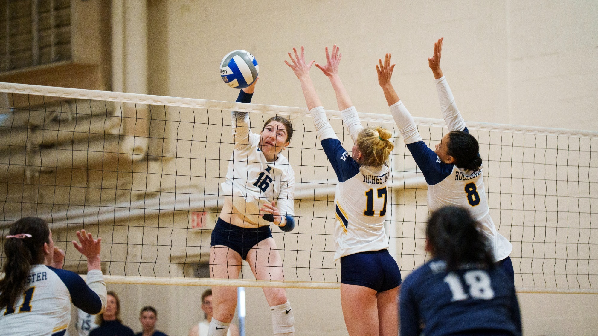 Anna Ertischek goes for an attack against Rochester with two blockers to her right