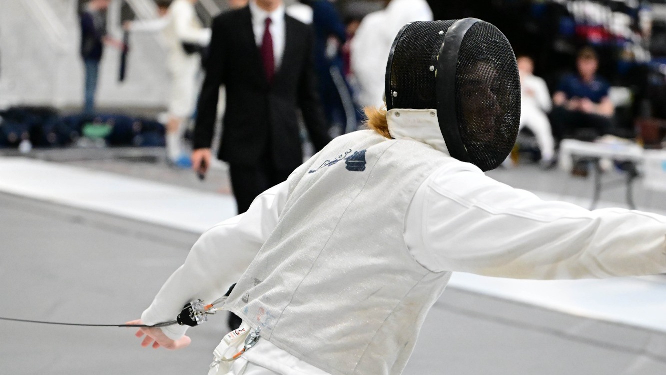 Jackson Sullivan lunges with his foil during a match