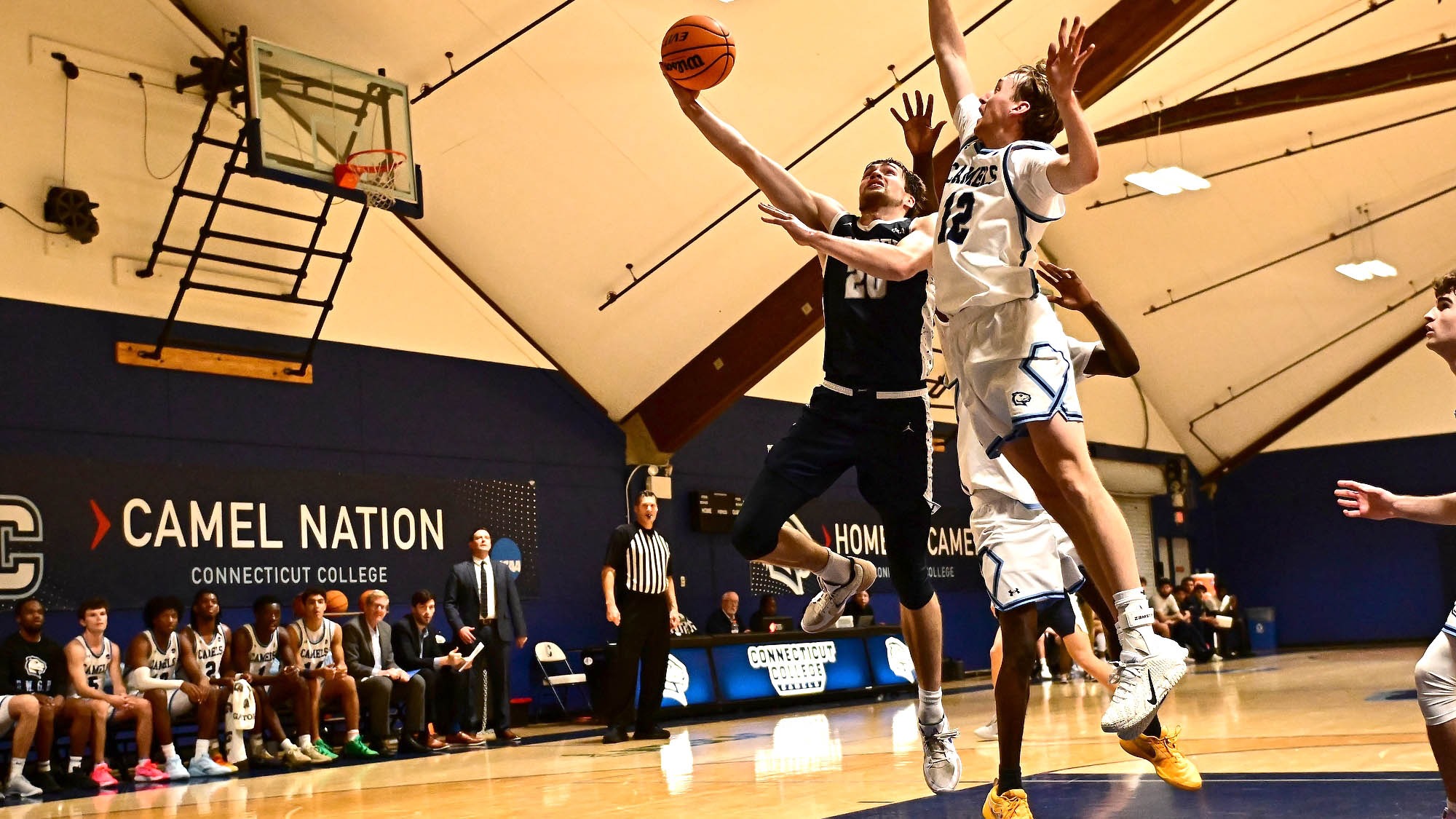 Elias Rodl goes to the hoop for a scoop shot against Conn College