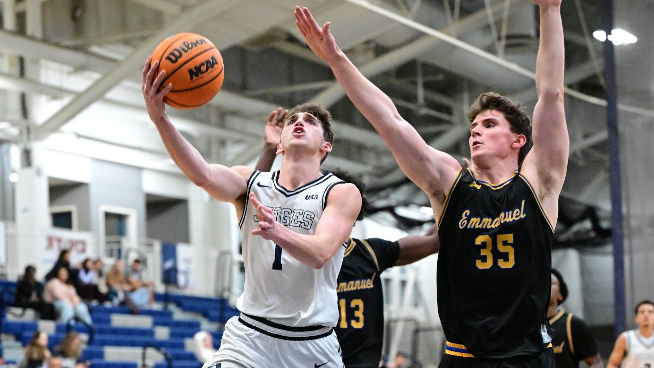 Alex Zakheim hits a lay-up after driving by a defender