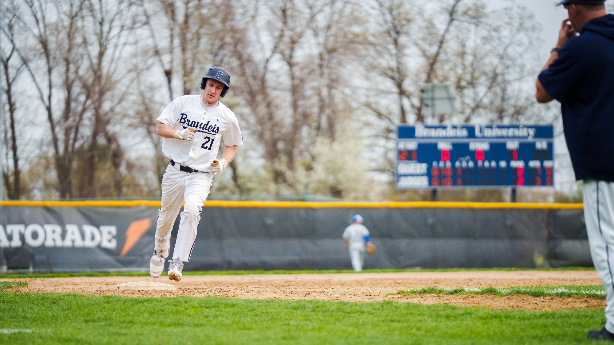 Jake Freed rounds third after hitting a game-tying home run