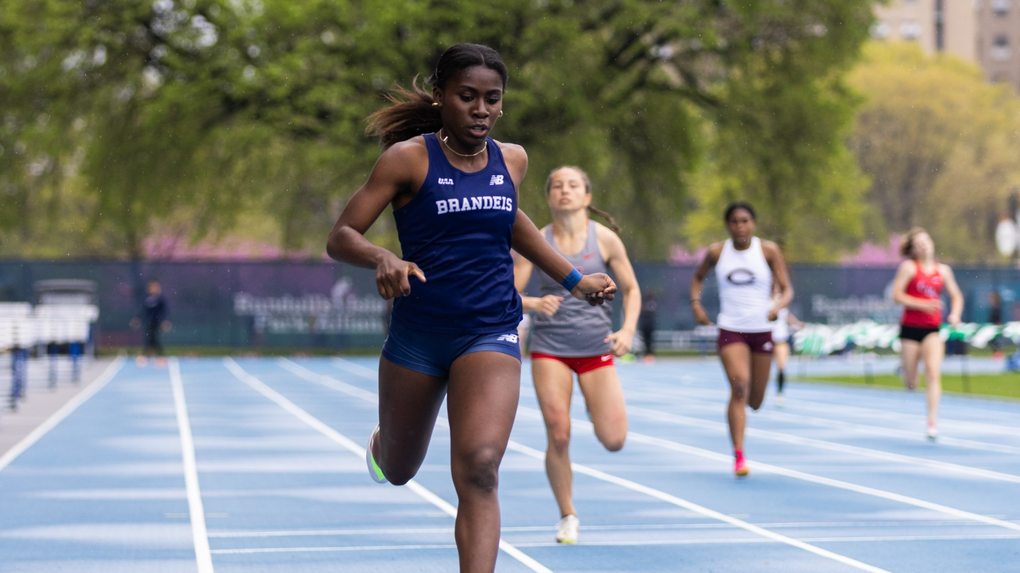 Peterly Leroy crosses the finish line in a race at the UAA track championships