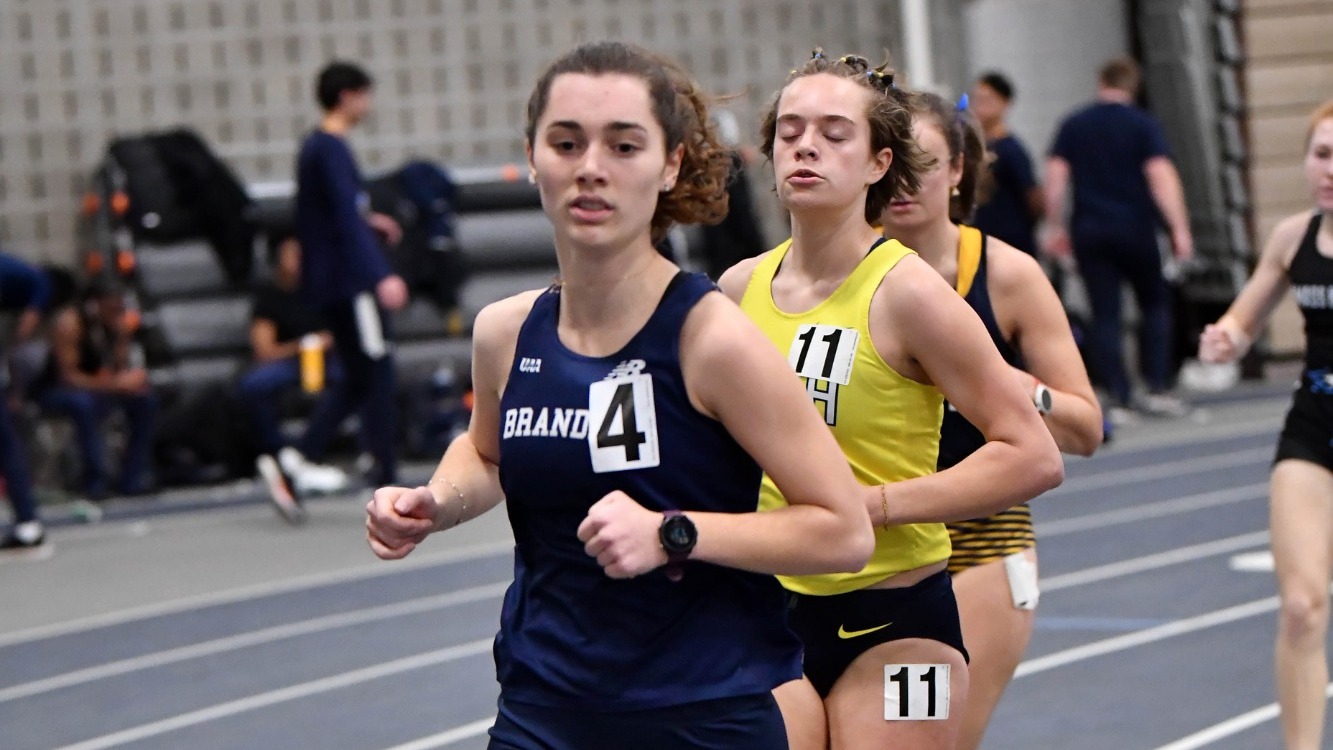 Sadie Harrow leads a handful of other runners during a race indoors