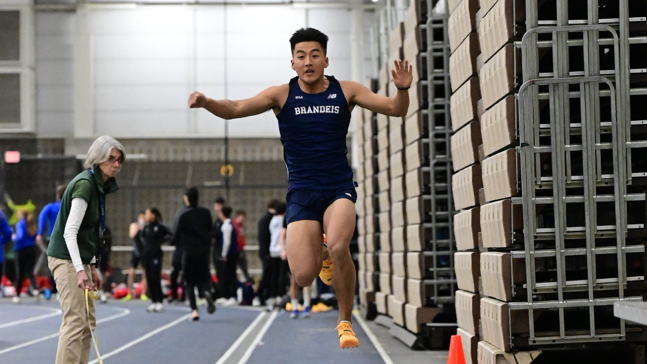 Matthew Yue competes in the triple jump