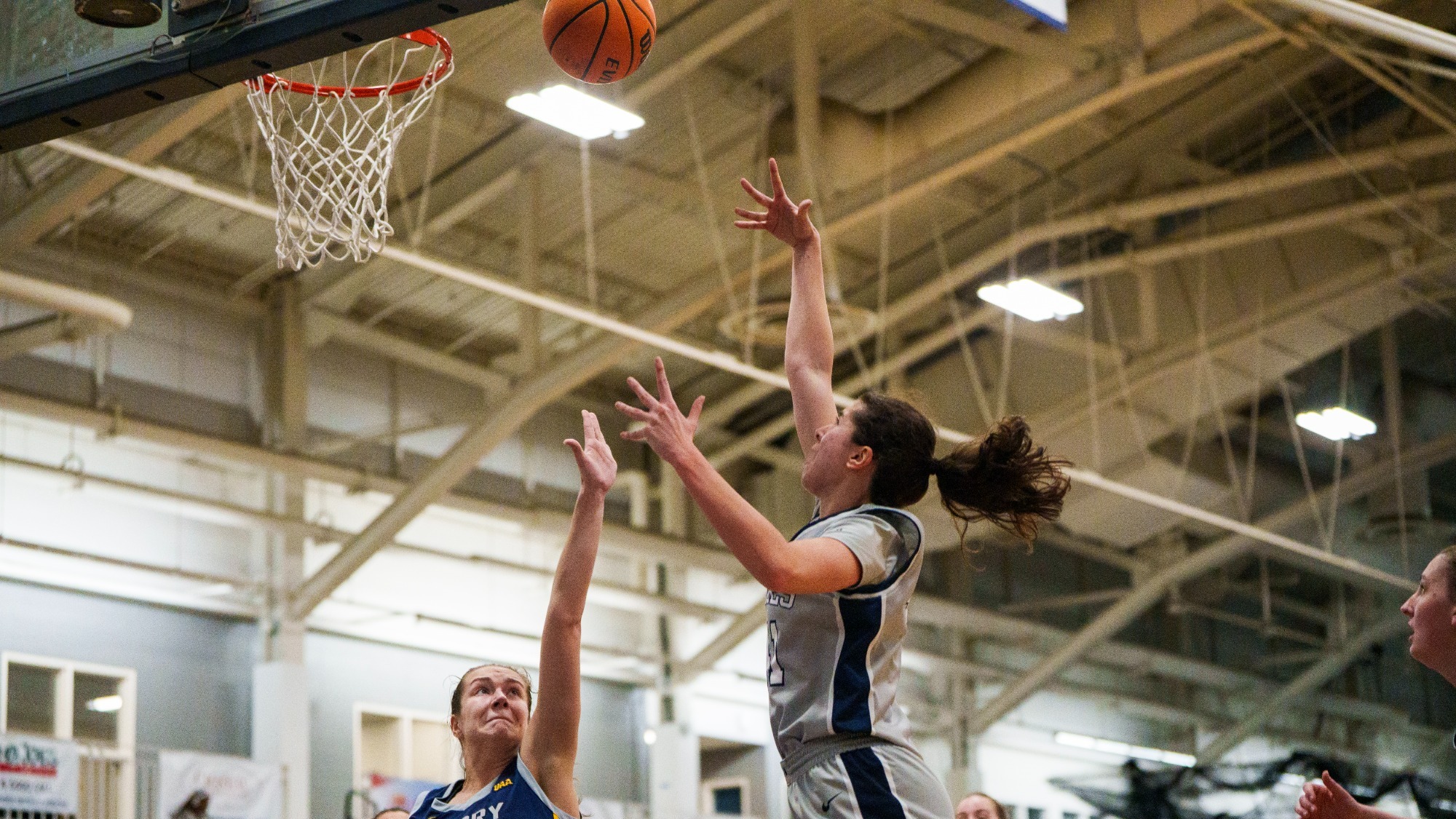 Elena Delicado shooting a hook shot during a basketball game