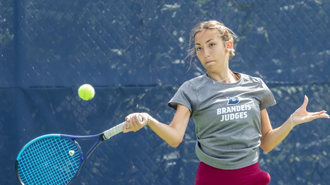 Milana Sofizade hits a forehand during a tennis match
