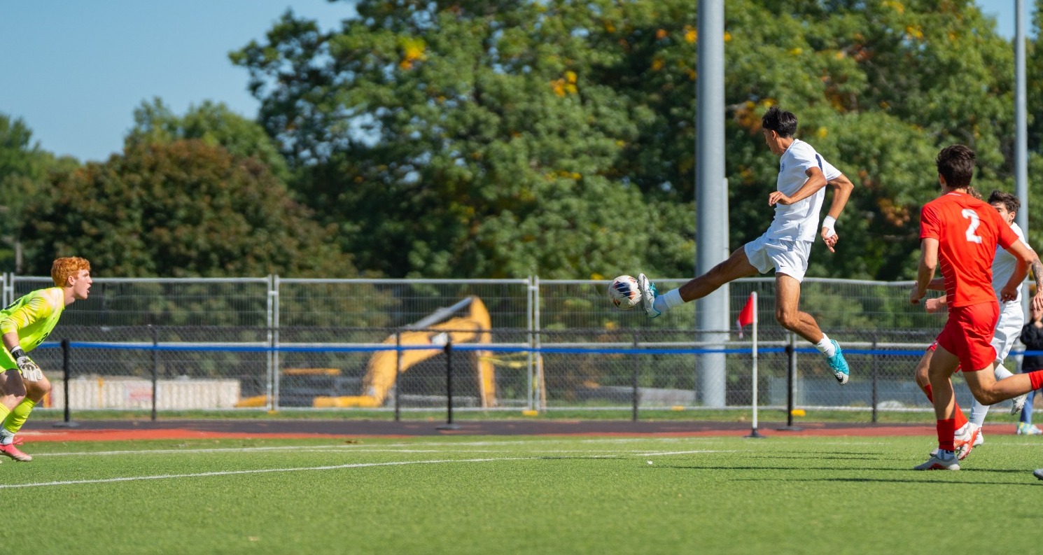 Keller Chamovitz skies to get a foot on the ball during a soccer match